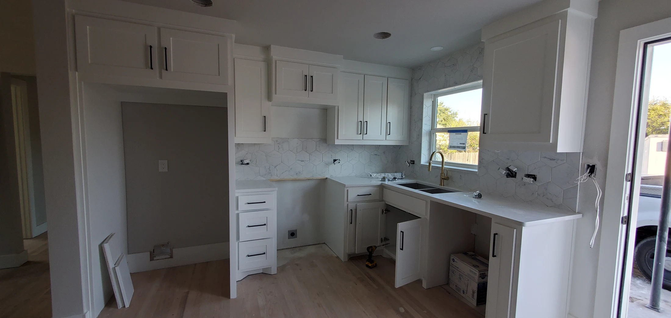 Cabinetry, flooring and finish installation